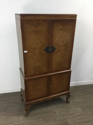 Lot 211 - A WALNUT COCKTAIL CABINET