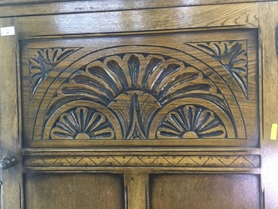 Lot 85 - A CARVED OAK HALL WARDROBE