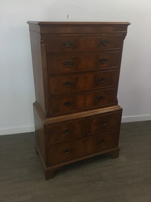 Lot 246 - A REPRODUCTION WALNUT CHEST ON CHEST