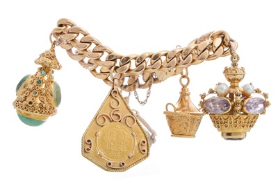 Lot 505 - EIGHTEEN CARAT GOLD CHARM BRACELET