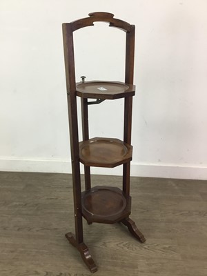 Lot 104 - A MAHOGANY FOLDING CAKE STAND