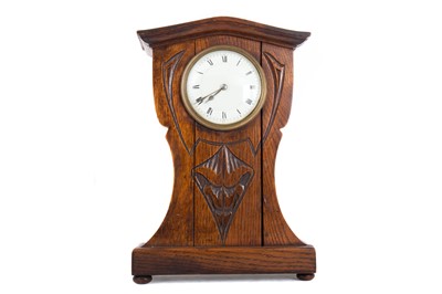 Lot 596 - ARTS & CRAFTS OAK MANTEL CLOCK