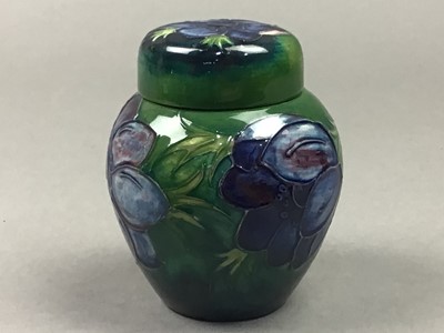 Lot 187 - A MOORCROFT LIDDED JAR AND COVER, LAMP AND DISH