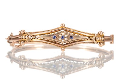 Lot 670 - SAPPHIRE AND PEARL BANGLE