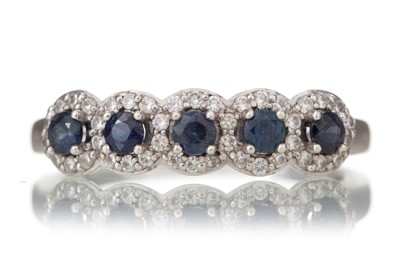 Lot 673 - SAPPHIRE AND DIAMOND CLUSTER BAND