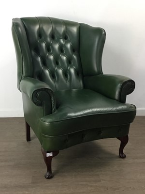 Lot 407 - A GREEN LEATHER WING BACK ARMCHAIR