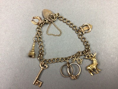 Lot 116 - NINE CARAT GOLD CHARM BRACELET