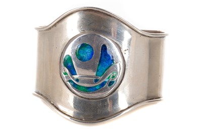 Lot 488 - ARCHIBALD KNOX (BRITISH, 1864-1933) FOR LIBERTY & CO., ARTS & CRAFTS SILVER AND ENAMEL NAPKIN RING