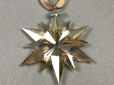 Lot 243 - THREE SWAROVSKI CHRISTMAS STARS