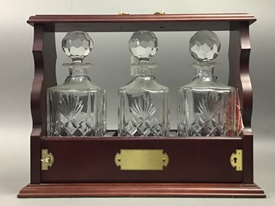 Lot 519 - THREE DECANTER TANTALUS