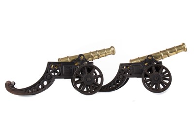 Lot 22 - A PAIR OF BRASS AND CAST IRON SIGNAL CANNONS