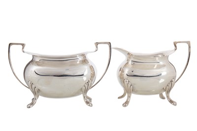 Lot 166 - GEORGE V SILVER CREAM JUG AND SUGAR BOWL