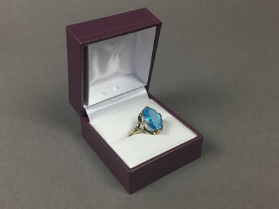 Lot 216 - NINE CARAT GOLD AND TOPAZ DRESS RING