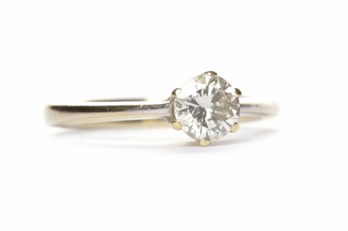 Lot 26 - DIAMOND SOLITAIRE RING the six claw set round...