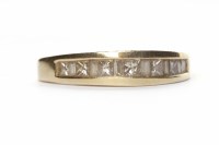 Lot 27 - DIAMOND SET BAND with channel set with...