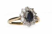 Lot 31 - SAPPHIRE AND DIAMOND CLUSTER RING set with a...
