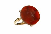Lot 34 - CARVED HARDSTONE RING the hardstone of...
