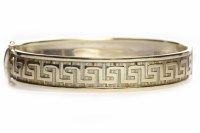Lot 39 - NINE CARAT GOLD BANGLE of oval form, with...