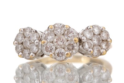 Lot 436 - DIAMOND TRIPLE DAISY CLUSTER RING