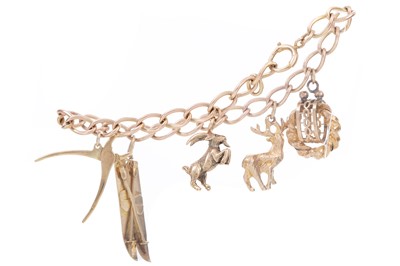 Lot 595 - GOLD CHARM BRACELET