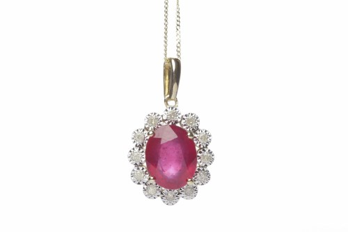 Lot 91 - RUBY AND DIAMOND CLUSTER PENDANT the oval ruby...