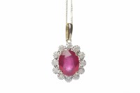 Lot 91 - RUBY AND DIAMOND CLUSTER PENDANT the oval ruby...
