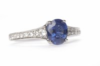 Lot 103 - SAPPHIRE AND DIAMOND RING set with an oval...