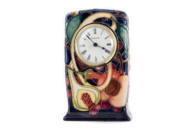 Lot 880 - EMMA BOSSONS FOR MOORCROFT, 'QUEEN'S CHOICE' MANTEL CLOCK AND LAMP