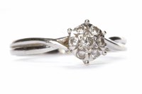 Lot 146 - DIAMOND CLUSTER RING set with round brilliant...