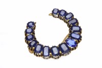 Lot 152 - CREATED SAPPHIRE AND GEM SET BROOCH of...