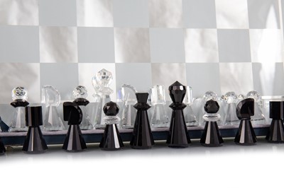 Lot 69 - SWAROVSKI, 'SILVER CRYSTAL' CLEAR AND BLACK CUT GLASS CHESS SET