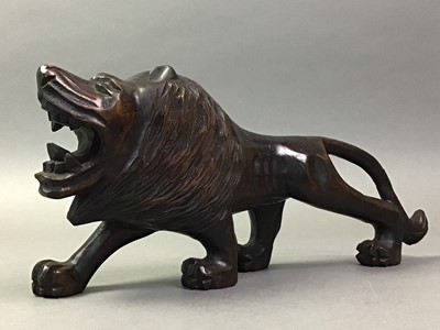 Lot 392 - CARVED WOOD MODEL OF A LION