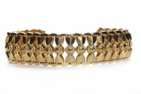 Lot 257 - EIGHTEEN CARAT GOLD BRACELET with a central...