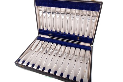 Lot 77 - SET OF TWELVE GEORGE VI SILVER FISH KNIVES AND FORKS