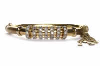 Lot 295 - EIGHTEEN CARAT GOLD BANGLE with seven overlaid...