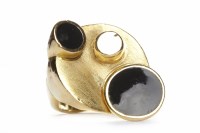 Lot 300 - EIGHTEEN CARAT GOLD ONYX SET RING set with two...