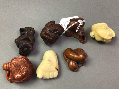 Lot 3 - COLLECTION OF CARVED WOOD AND TAGUA NUT NETSUKE