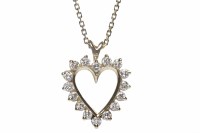 Lot 336 - DIAMOND SET HEART PENDANT set with round...