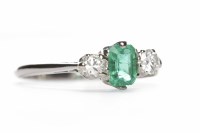 Lot 358 - PLATINUM EMERALD AND DIAMOND THREE STONE RING...