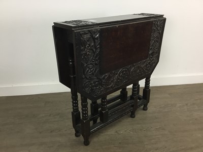 Lot 484 - CARVED OAK DROP LEAF TEA TABLE