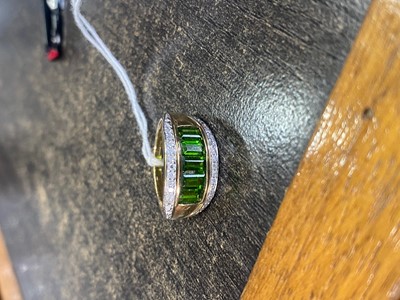 Lot 498 - DEMANTOID GARNET AND DIAMOND RING