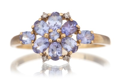 Lot 514 - TANZANITE AND DIAMOND DRESS RING