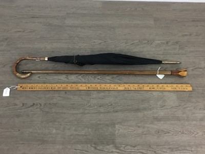 Lot 685 - UMBRELLA, CANE AND MEASURING STICK