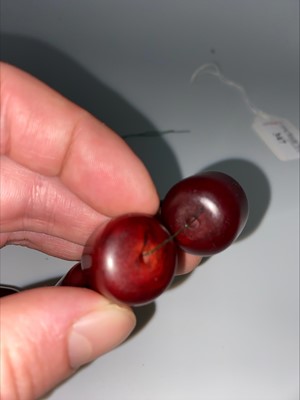 Lot 348 - SET OF CHERRY AMBER BAKELITE NECKLACE