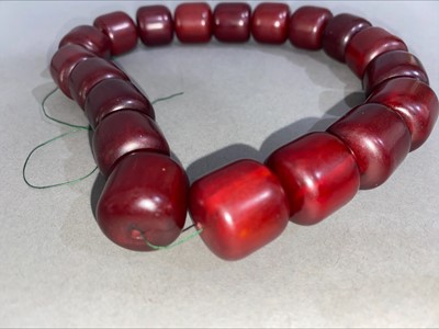 Lot 348 - SET OF CHERRY AMBER BAKELITE NECKLACE