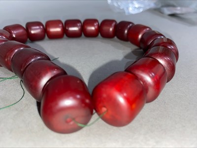 Lot 348 - SET OF CHERRY AMBER BAKELITE NECKLACE