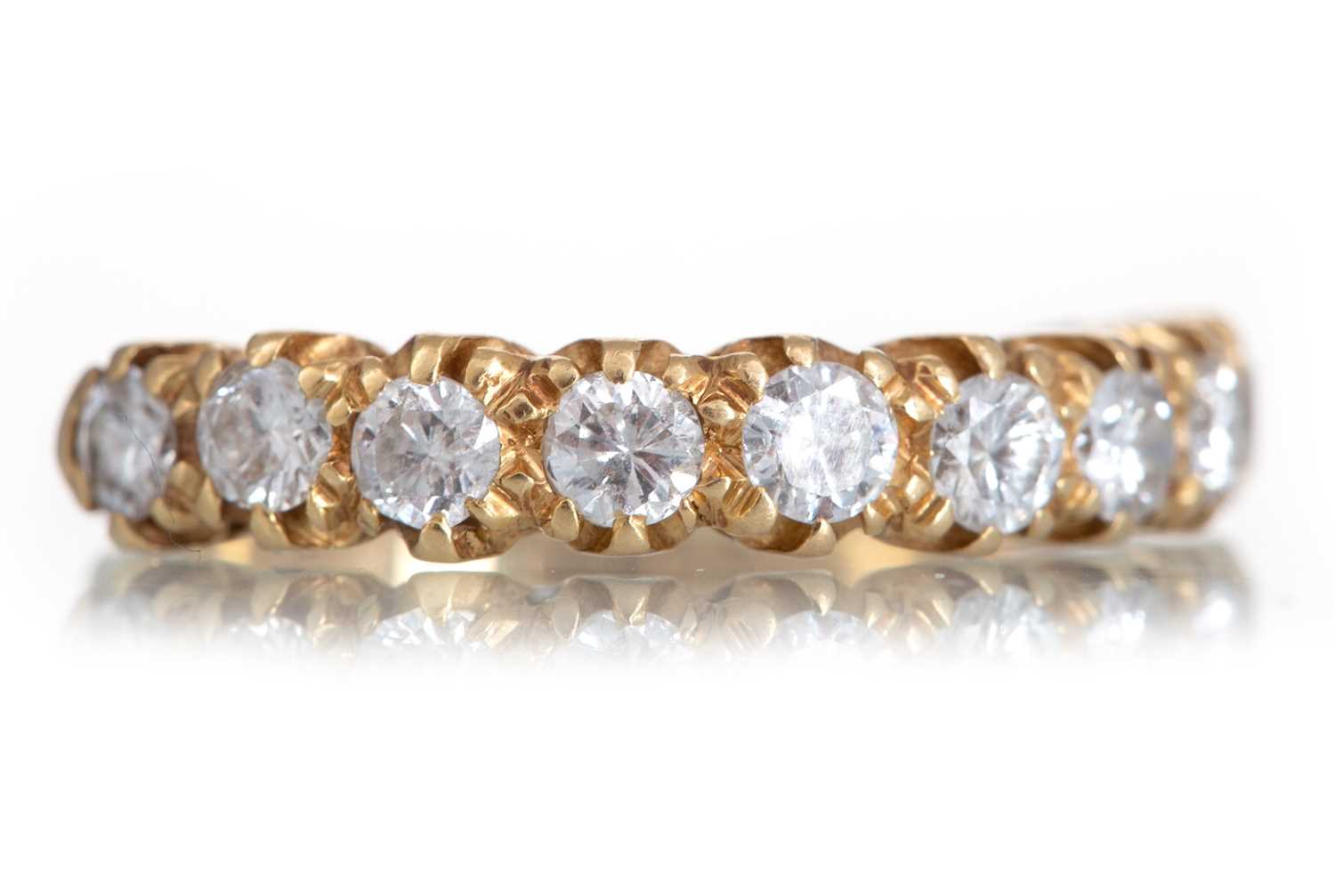 Lot 657 - DIAMOND NINE STONE RING