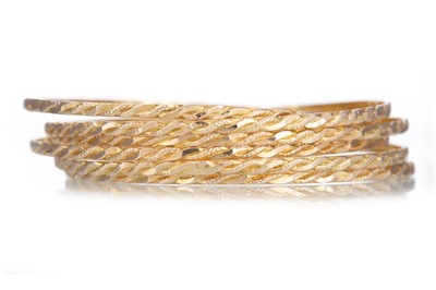 Lot 672 - SIX GOLD BANGLES