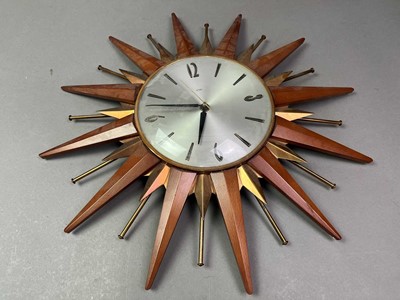 Lot 521 - VINTAGE METAMIC TEAK STARBUST WALL CLOCK