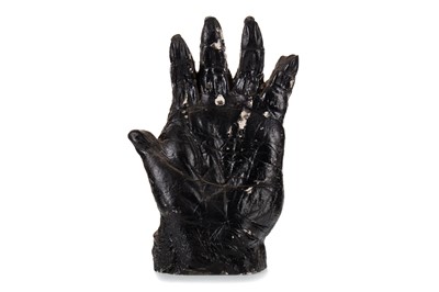 Lot 46 - BLACK PAINTED PLASTER MODEL OF A GORILLA HAND